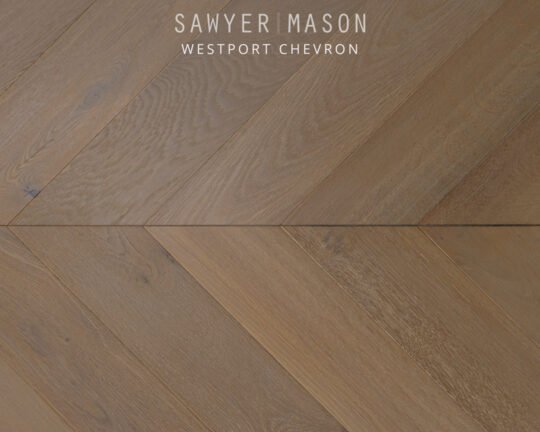 brown floor planks with small knots cut in a chevron pattern
